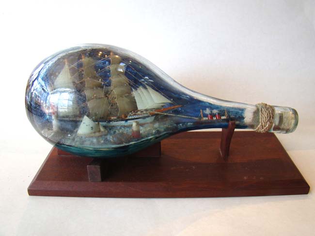 A fabulous late 19th or early 20th century Ship-in-a bottle diorama